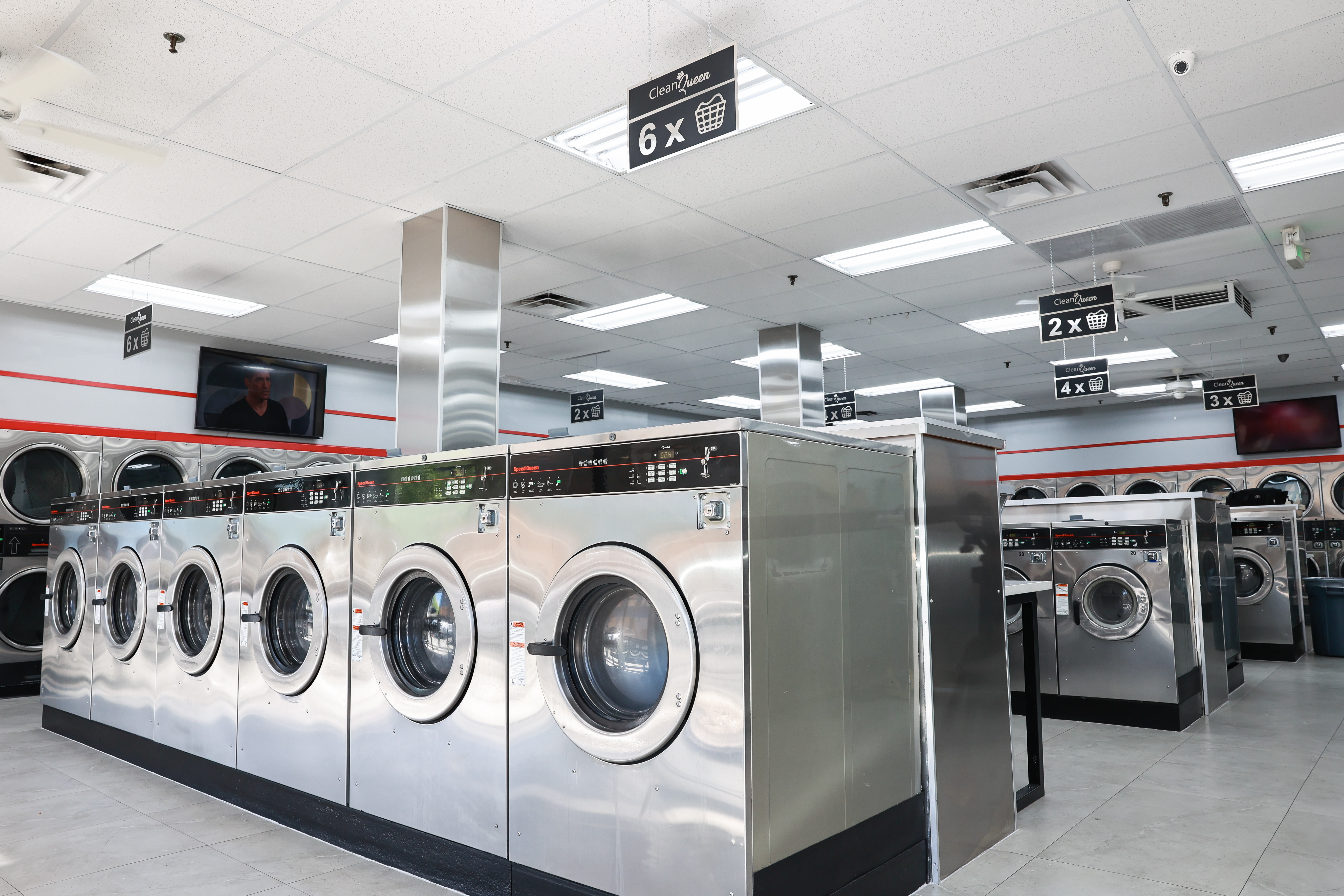 Large-capacity machines that handle towels, linens, and bulky loads at Clean Queen Laundry