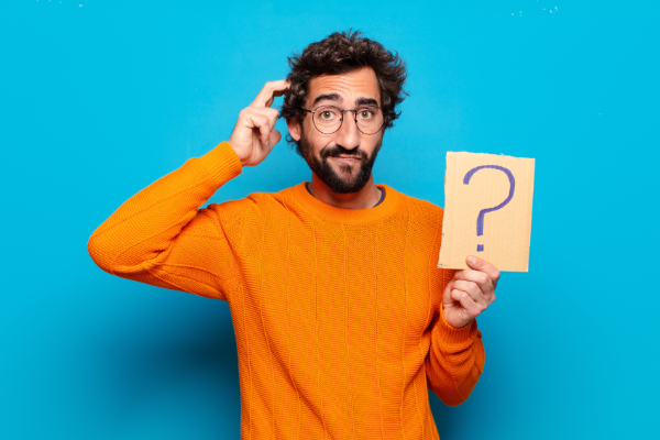 Man Holding Cardboard With Question Mark 600X400